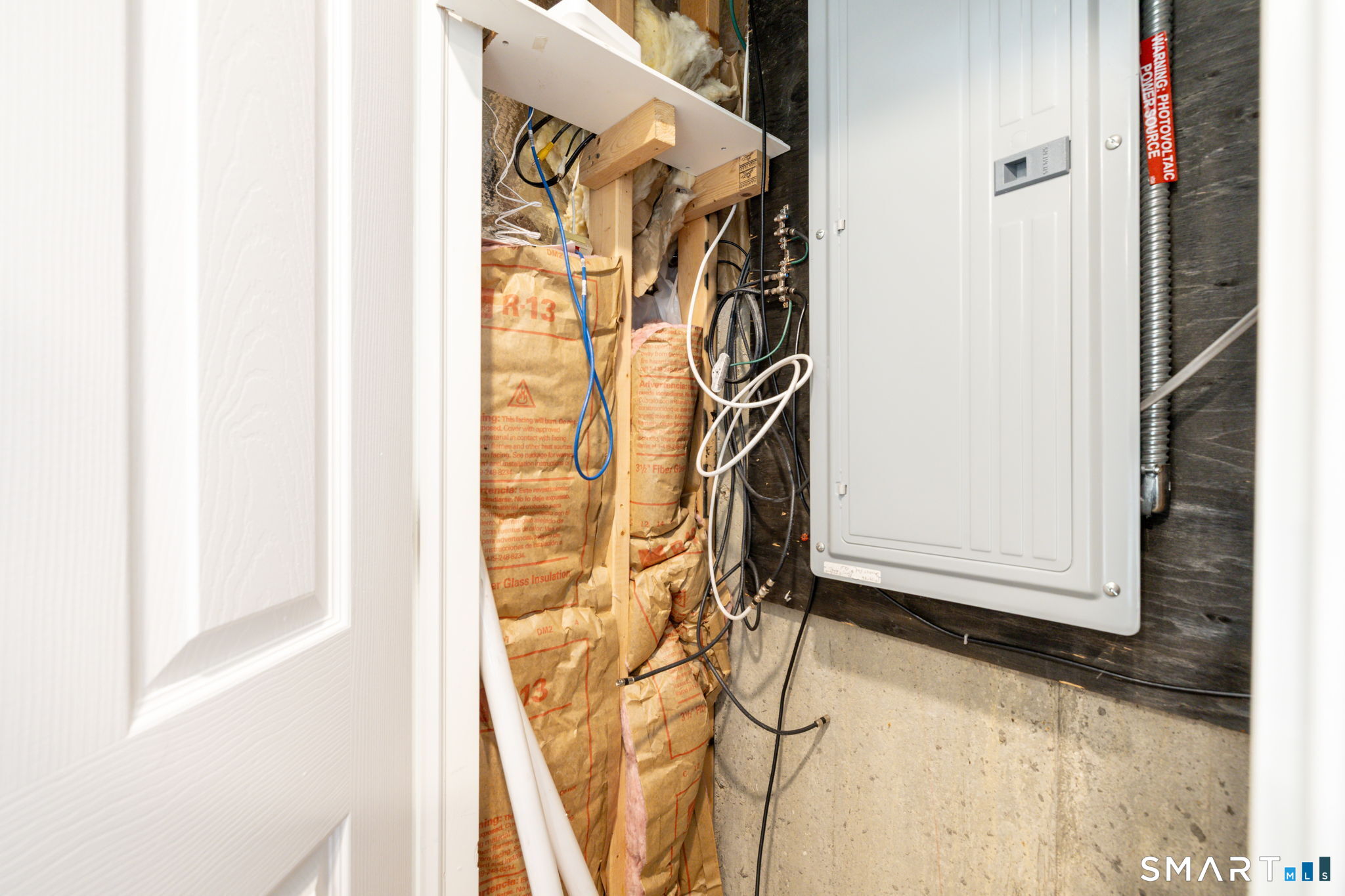234 Traverse Street Waterbury, CT 06704 - Photo 28 of 38 a view of walk in closet with clothes