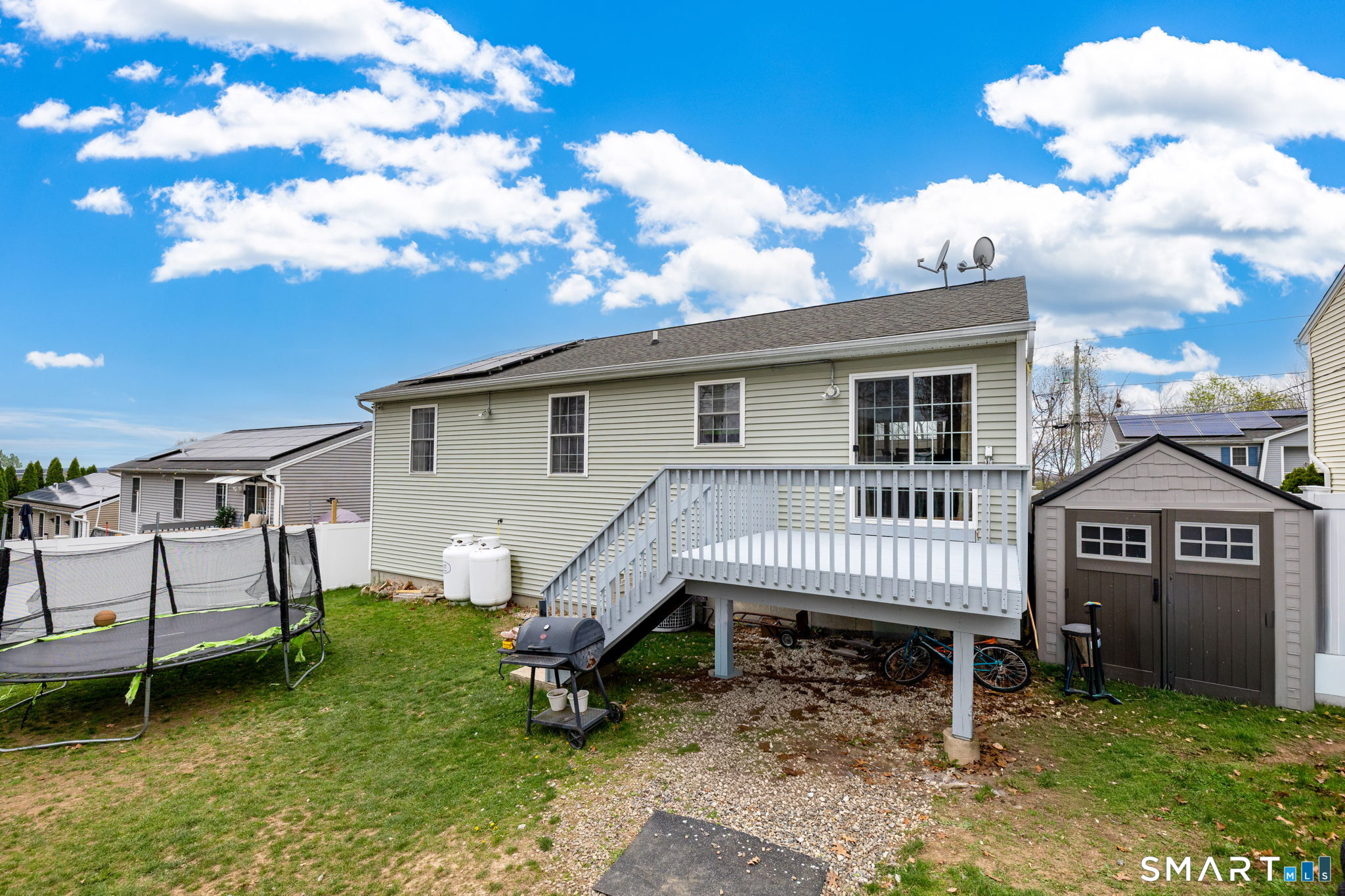 234 Traverse Street Waterbury, CT 06704 - Photo 32 of 38 a view of a house with a yard and deck