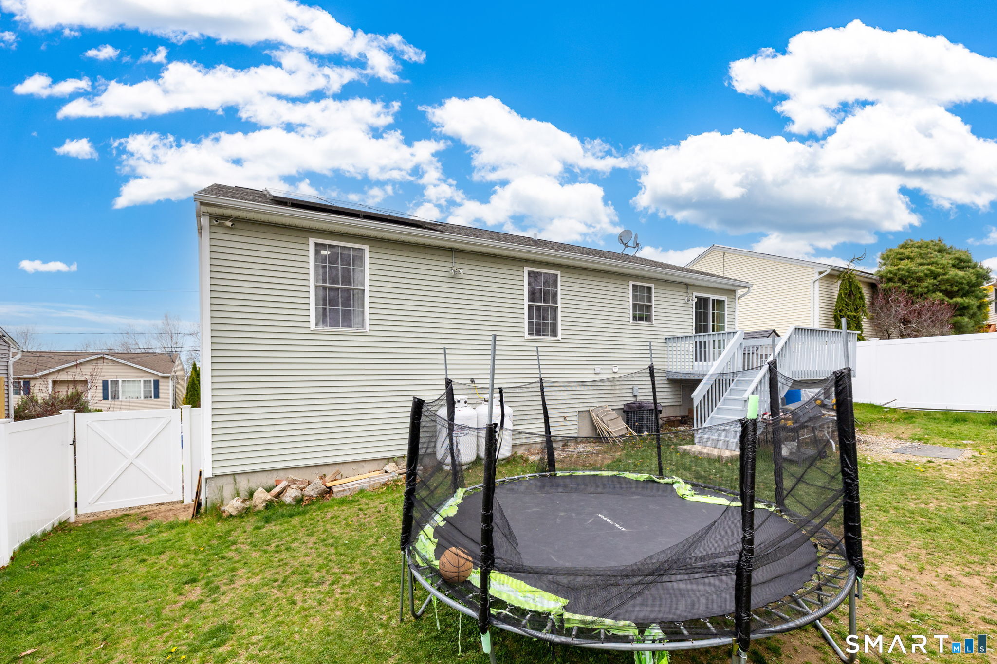 234 Traverse Street Waterbury, CT 06704 - Photo 37 of 38 a backyard of a house with table and chairs