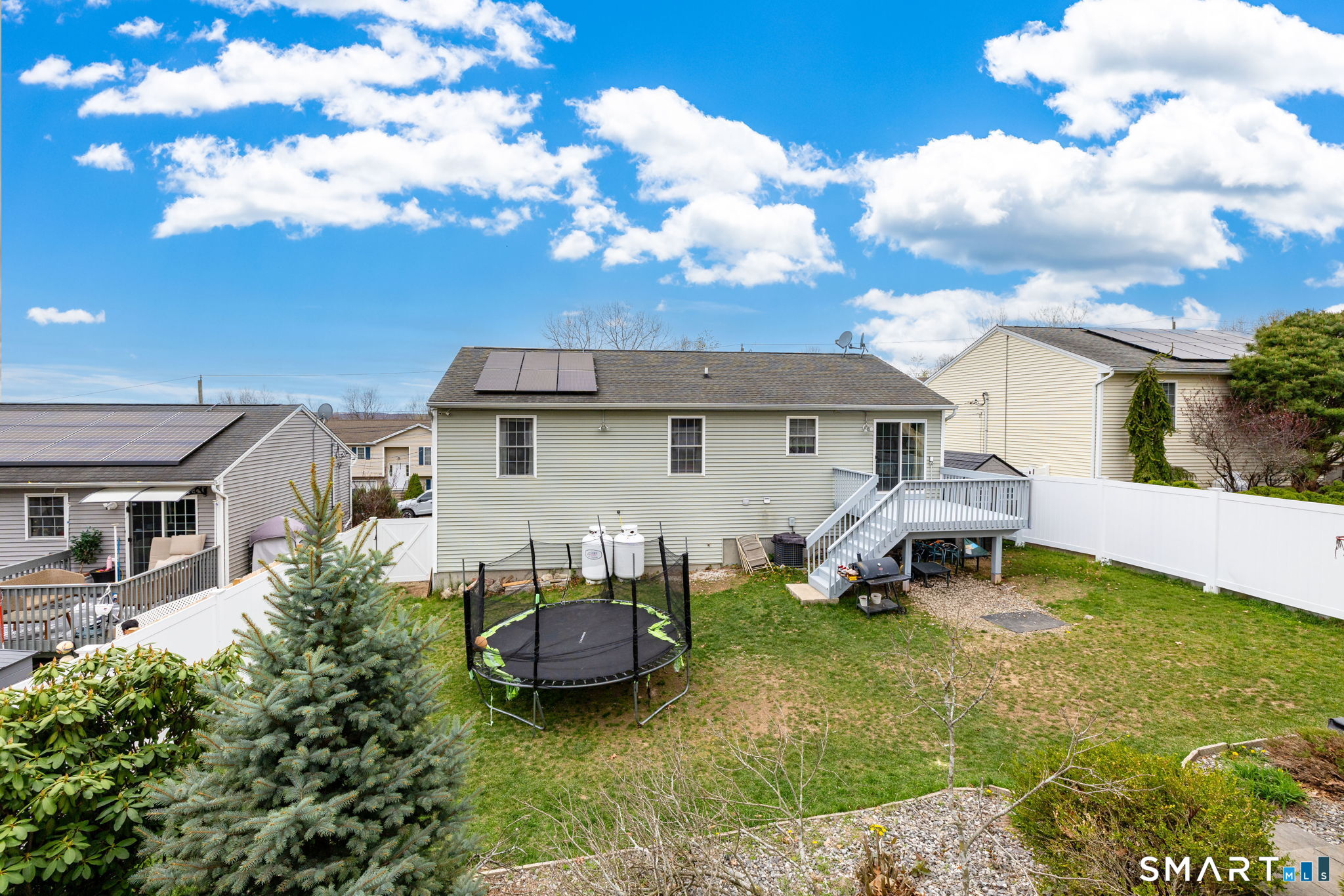 234 Traverse Street Waterbury, CT 06704 - Photo 38 of 38 a view of a house with backyard sitting area and garden