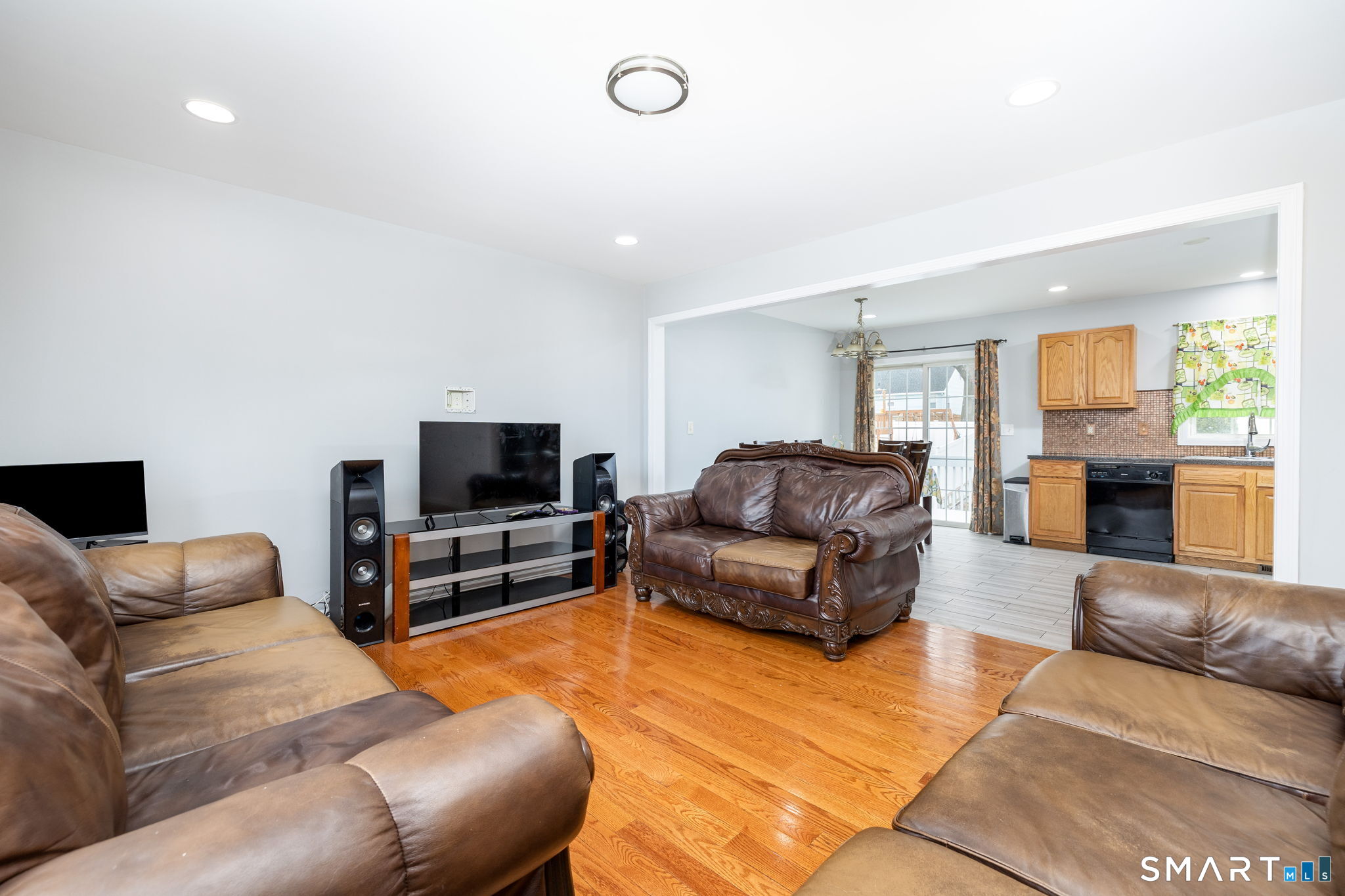 234 Traverse Street Waterbury, CT 06704 - Photo 9 of 38 a living room with furniture and a flat screen tv