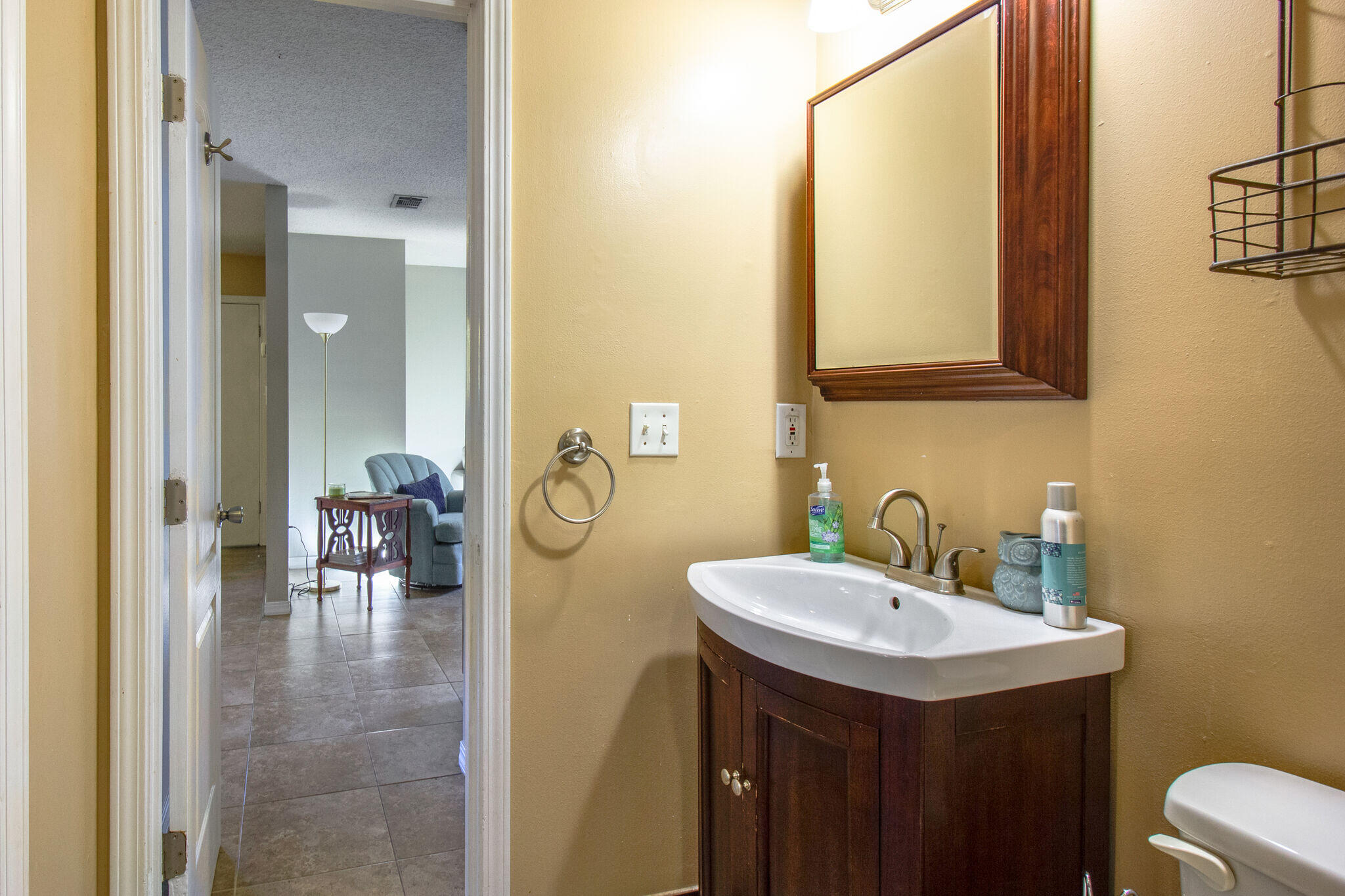 112 James Street Crestview, FL 32536 - Photo 11 of 16 a bathroom with a sink and a mirror