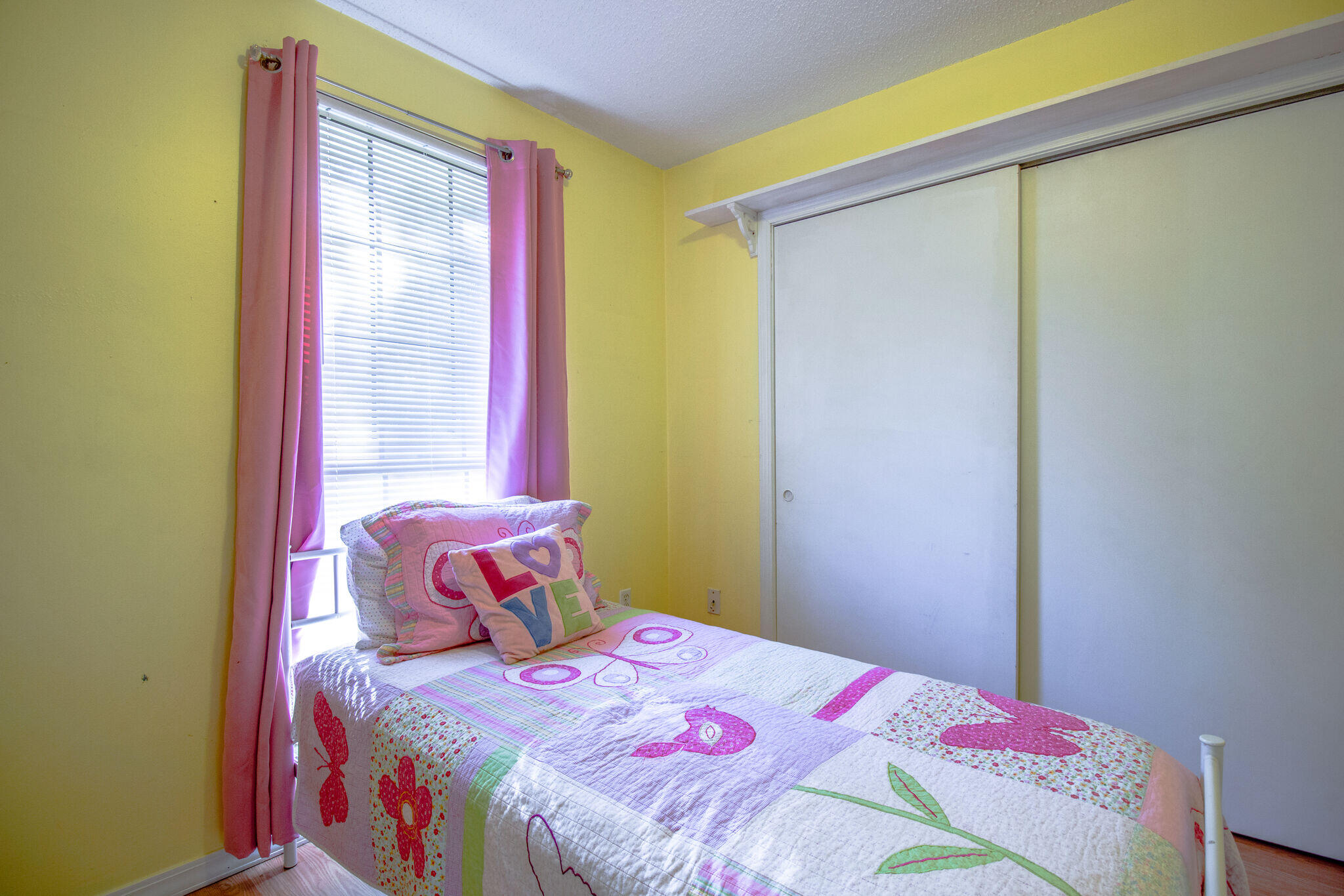 112 James Street Crestview, FL 32536 - Photo 12 of 16 a bedroom with a bed and a window