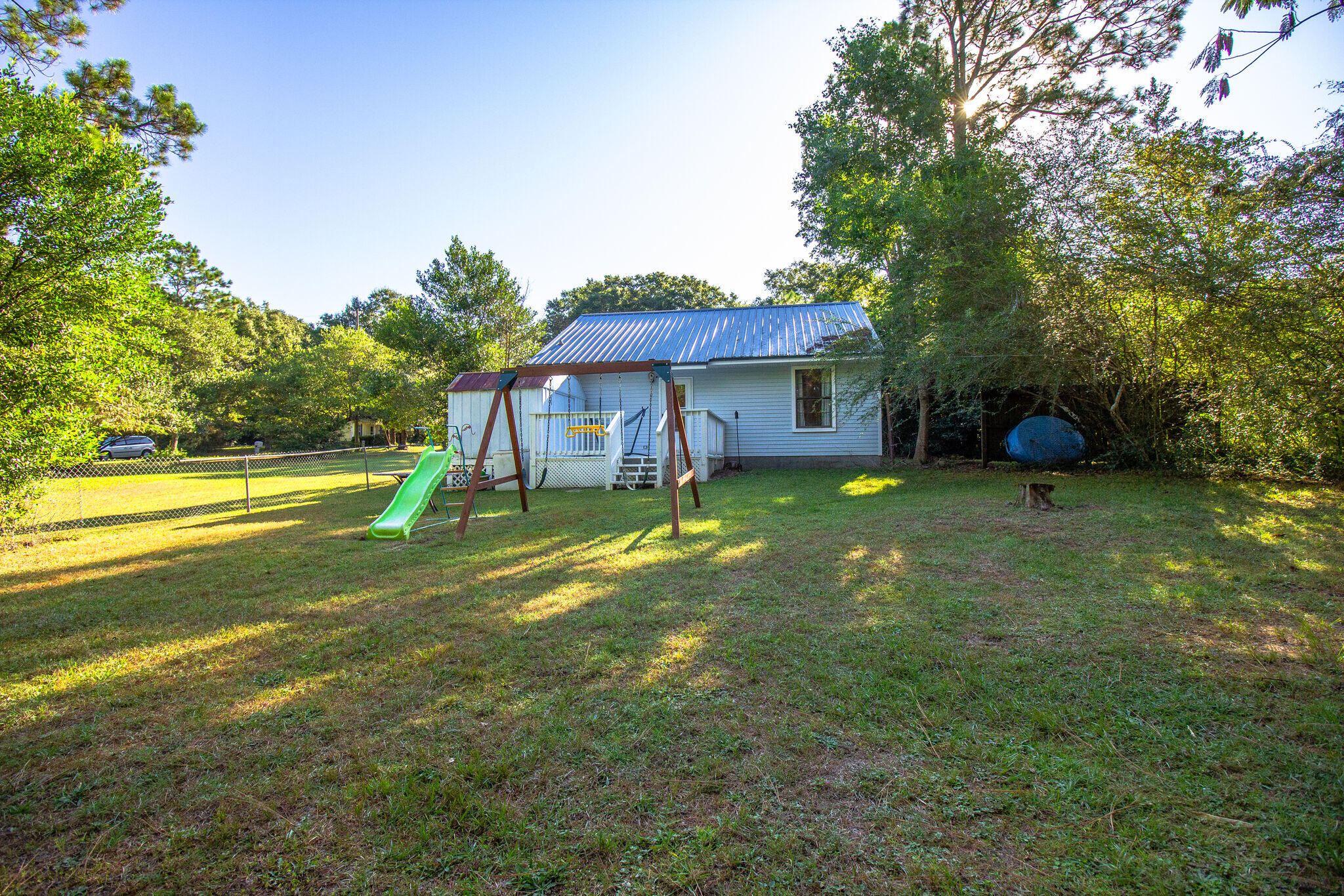 112 James Street Crestview, FL 32536 - Photo 16 of 16 a view of a house with a yard porch and sitting area