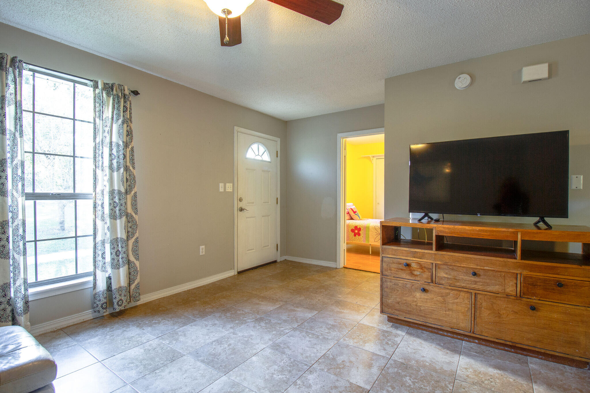 112 James Street Crestview, FL 32536 - Photo 4 of 16 a living room with furniture and flat screen tv