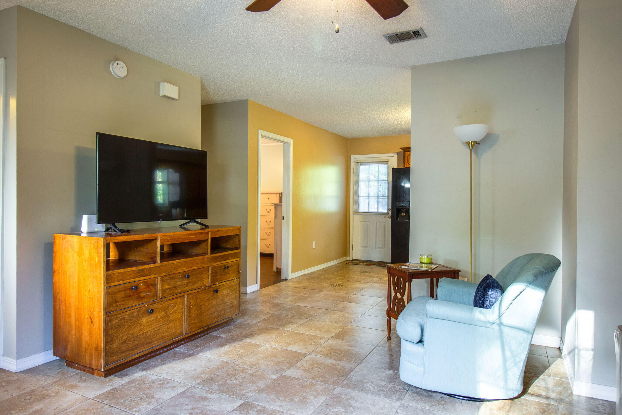 112 James Street Crestview, FL 32536 - Photo 5 of 16 a living room with furniture and a flat screen tv