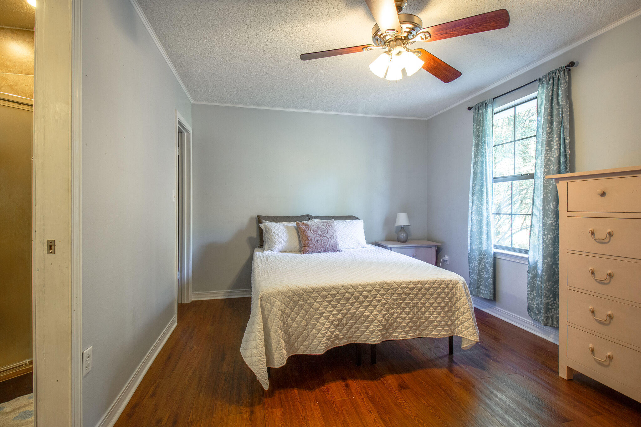 112 James Street Crestview, FL 32536 - Photo 9 of 16 a bedroom with a bed and a dresser