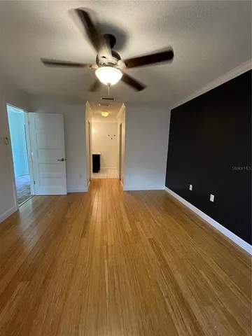 a view of a livingroom with wooden floor