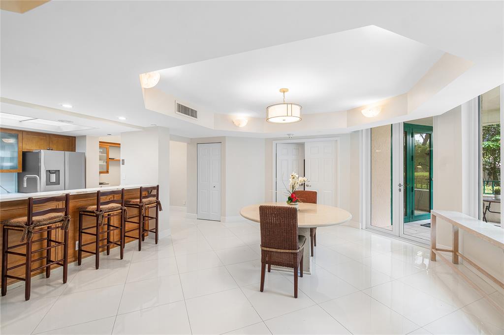 100 Southeast 5th Avenue, Unit 110 Boca Raton, FL 33432 - Photo 12 of 52 a view of a dining room with furniture
