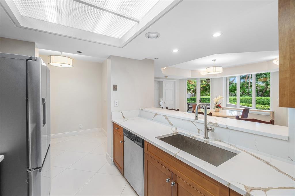 100 Southeast 5th Avenue, Unit 110 Boca Raton, FL 33432 - Photo 19 of 52 a kitchen with a sink and a large window