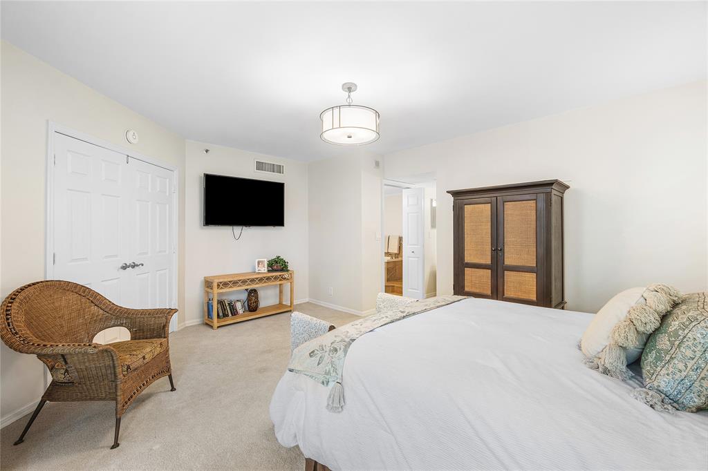 100 Southeast 5th Avenue, Unit 110 Boca Raton, FL 33432 - Photo 21 of 52 a bedroom with a bed and a flat screen tv