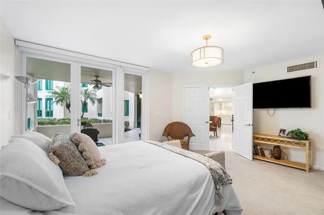 a bathroom with a granite countertop sink a mirror and a shower