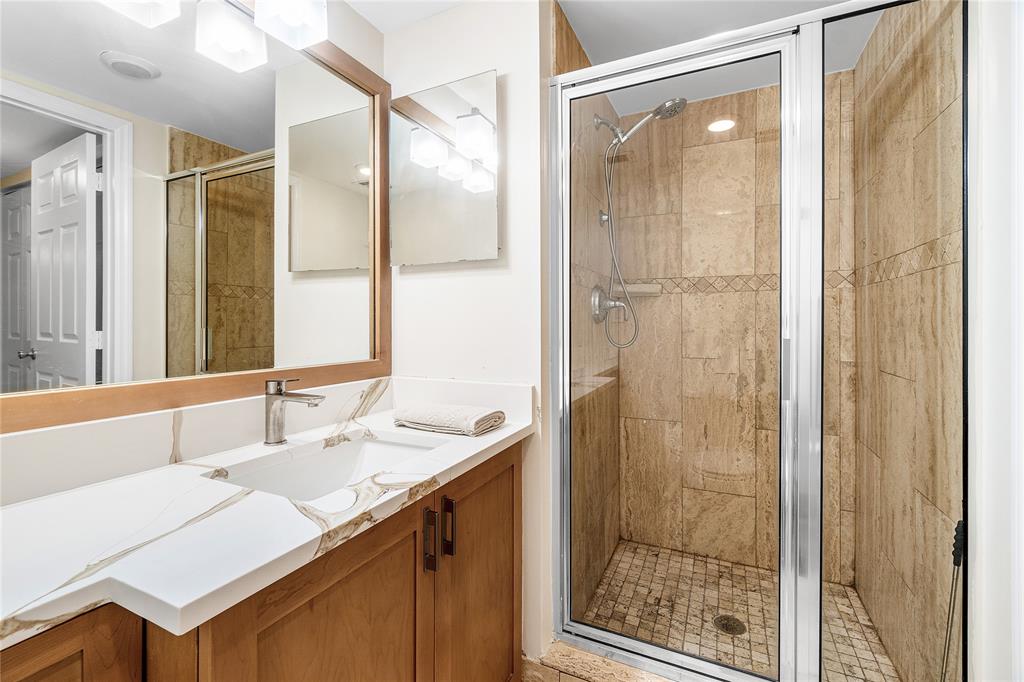 100 Southeast 5th Avenue, Unit 110 Boca Raton, FL 33432 - Photo 24 of 52 a bathroom with a shower sink and mirror