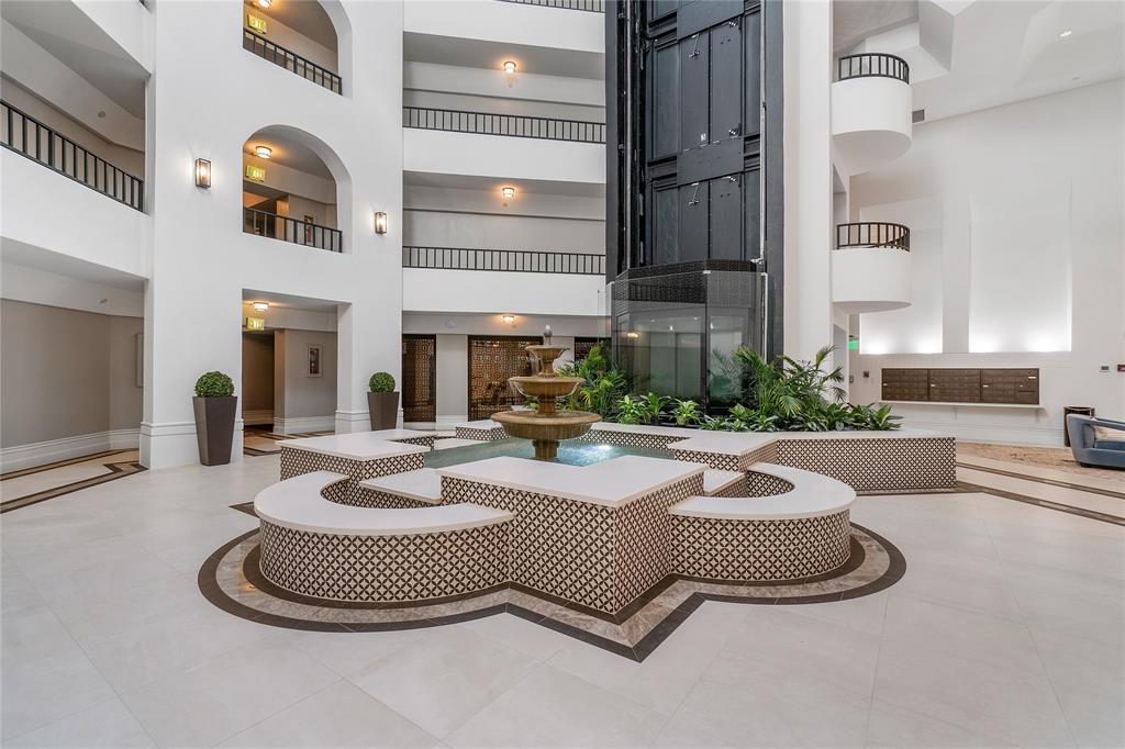 100 Southeast 5th Avenue, Unit 110 Boca Raton, FL 33432 - Photo 3 of 52 a living room with furniture and a fireplace