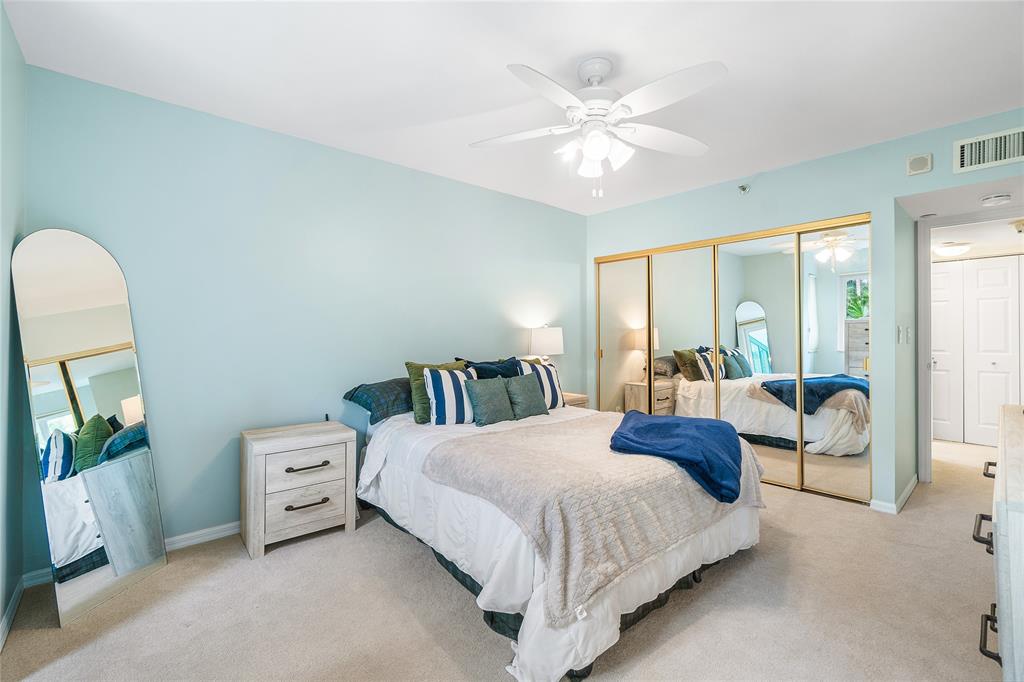 100 Southeast 5th Avenue, Unit 110 Boca Raton, FL 33432 - Photo 33 of 52 a bedroom with a bed a large window and couch