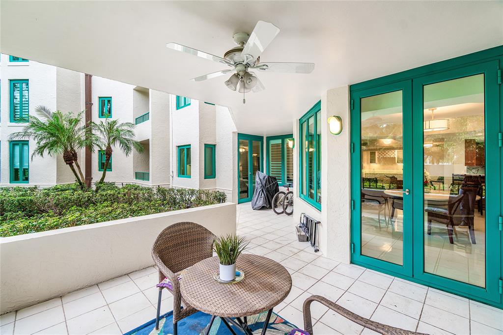 100 Southeast 5th Avenue, Unit 110 Boca Raton, FL 33432 - Photo 35 of 52 a view of a dining room with furniture wooden floor and chandelier