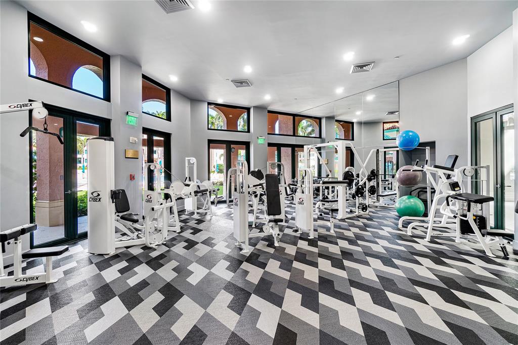 100 Southeast 5th Avenue, Unit 110 Boca Raton, FL 33432 - Photo 46 of 52 a very nice looking room with lots of white furniture