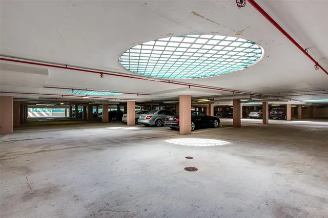 a front view of a house with a yard and palm trees