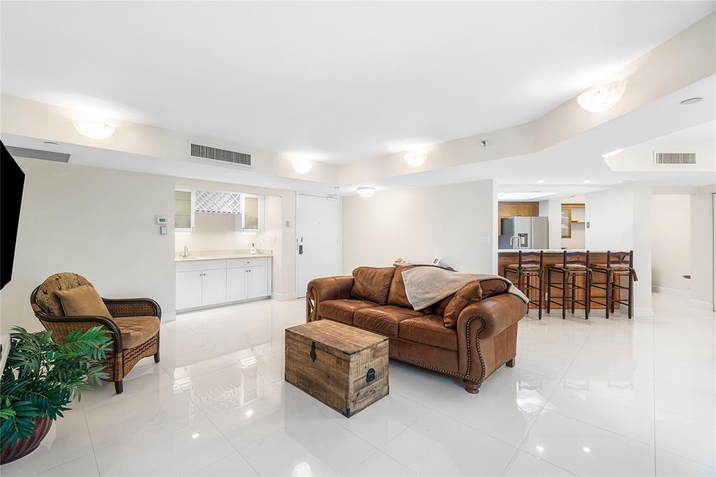 100 Southeast 5th Avenue, Unit 110 Boca Raton, FL 33432 - Photo 7 of 52 a living room with furniture and a window