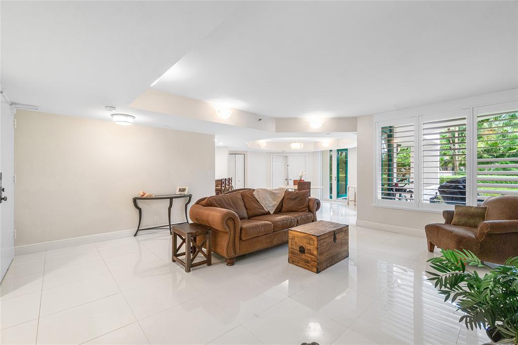 100 Southeast 5th Avenue, Unit 110 Boca Raton, FL 33432 - Photo 9 of 52 a living room with furniture and a large window