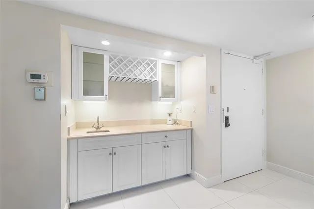 a dining room with a wooden table and chairs