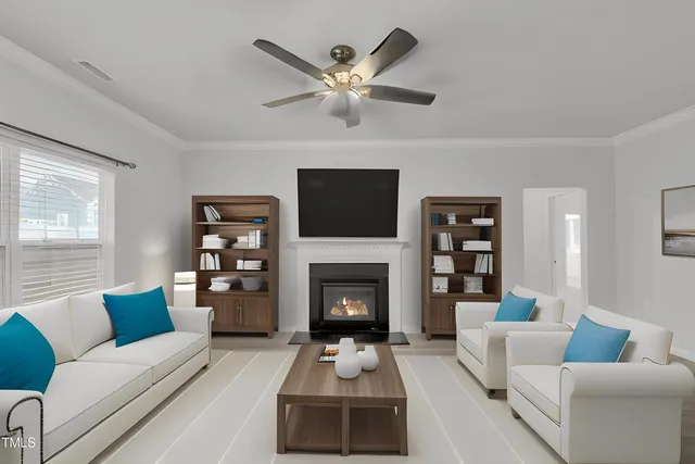 a living room with furniture a fireplace and a flat screen tv