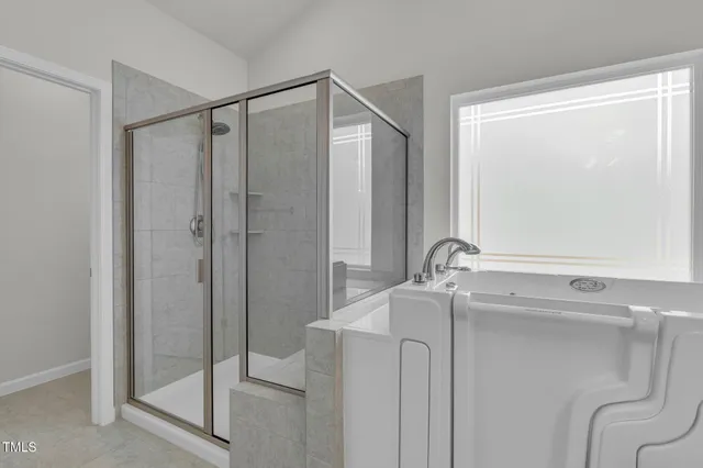a spacious bathroom with a double vanity sink mirror and double