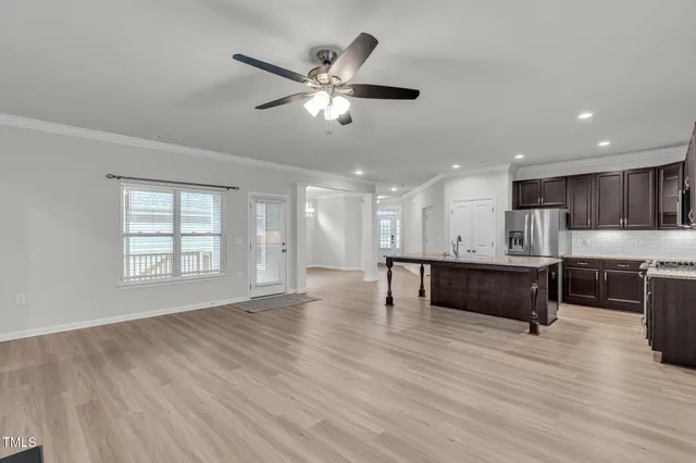 a view of kitchen with sink and wooden floor
