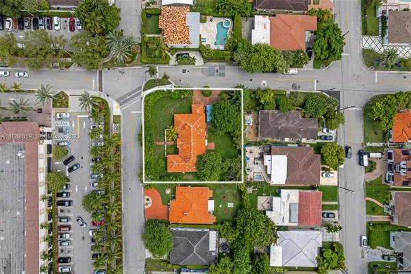 an aerial view of houses with yard