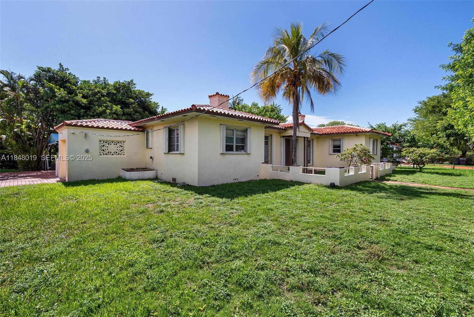 9400 Abbott Avenue Surfside, FL 33154 - Photo 5 of 15 a view of a house with a backyard
