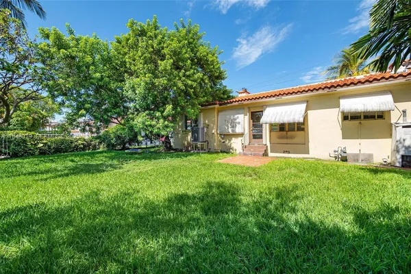 a house view with a garden space