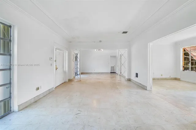 a view of a room with a closet and a fireplace