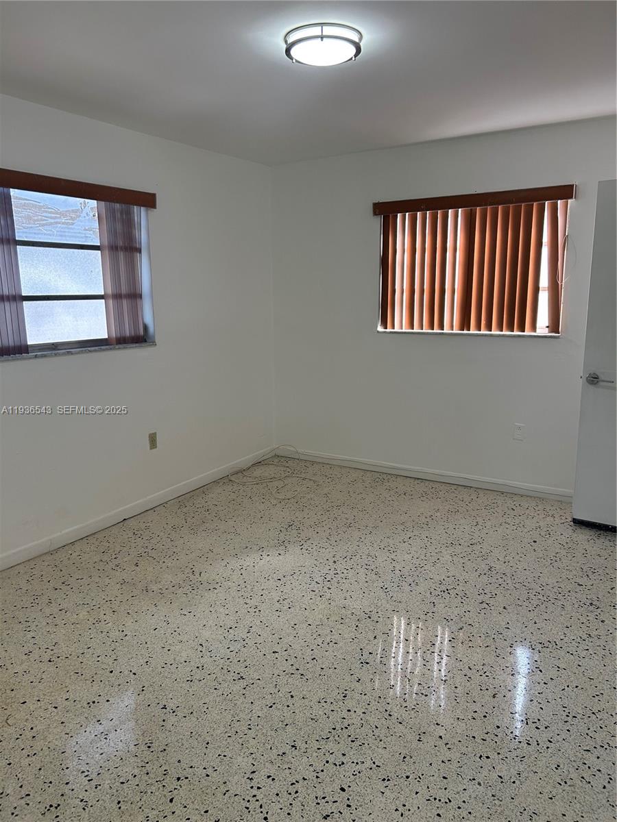 442 East 29th Street, Unit 442 Hialeah, FL 33013 - Photo 14 of 23 a view of an empty room and window