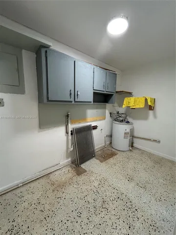 a room with a sink and a cabinets