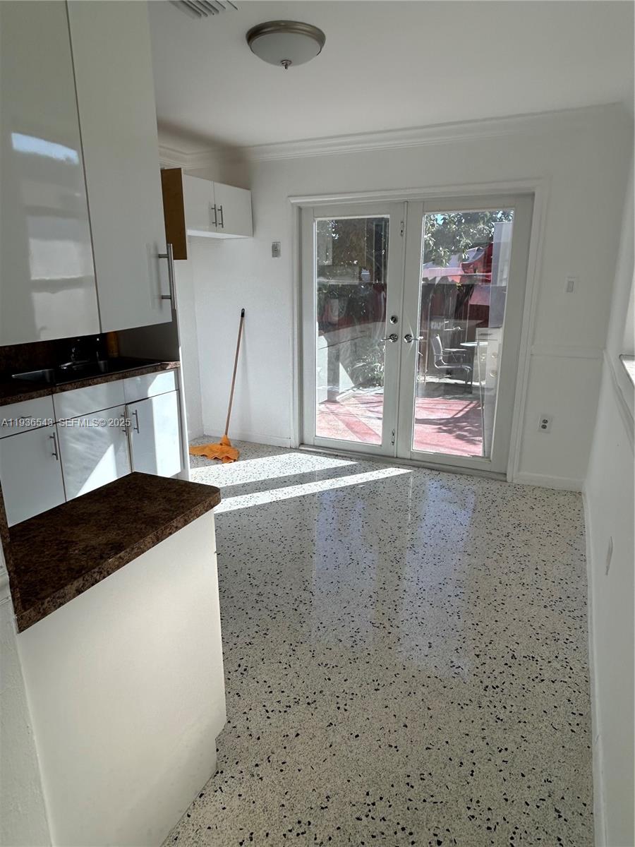 442 East 29th Street, Unit 442 Hialeah, FL 33013 - Photo 17 of 23 a kitchen with granite countertop a sink and a stove