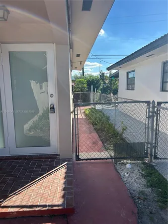 a view of backyard with a garden and deck