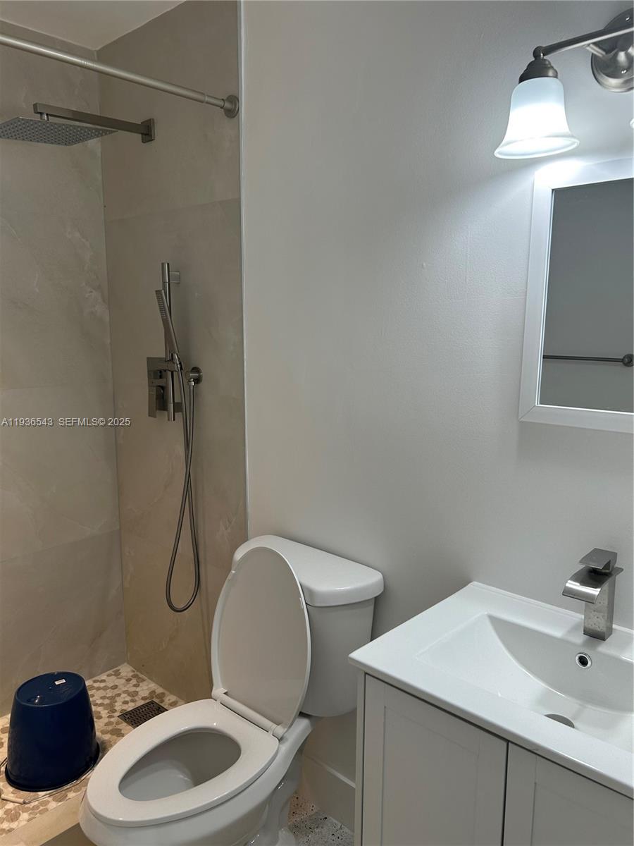 442 East 29th Street, Unit 442 Hialeah, FL 33013 - Photo 8 of 23 a bathroom with a sink a toilet and shower