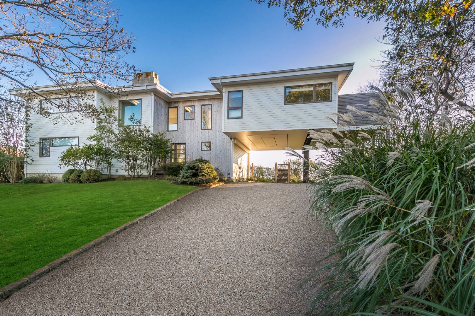 83 North Surfside Avenue Montauk, NY 11954 - Photo 2 of 26 a front view of house with yard and green space