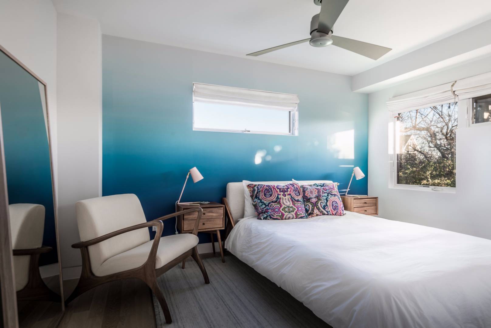 83 North Surfside Avenue Montauk, NY 11954 - Photo 13 of 26 a bedroom with a bed and a chair