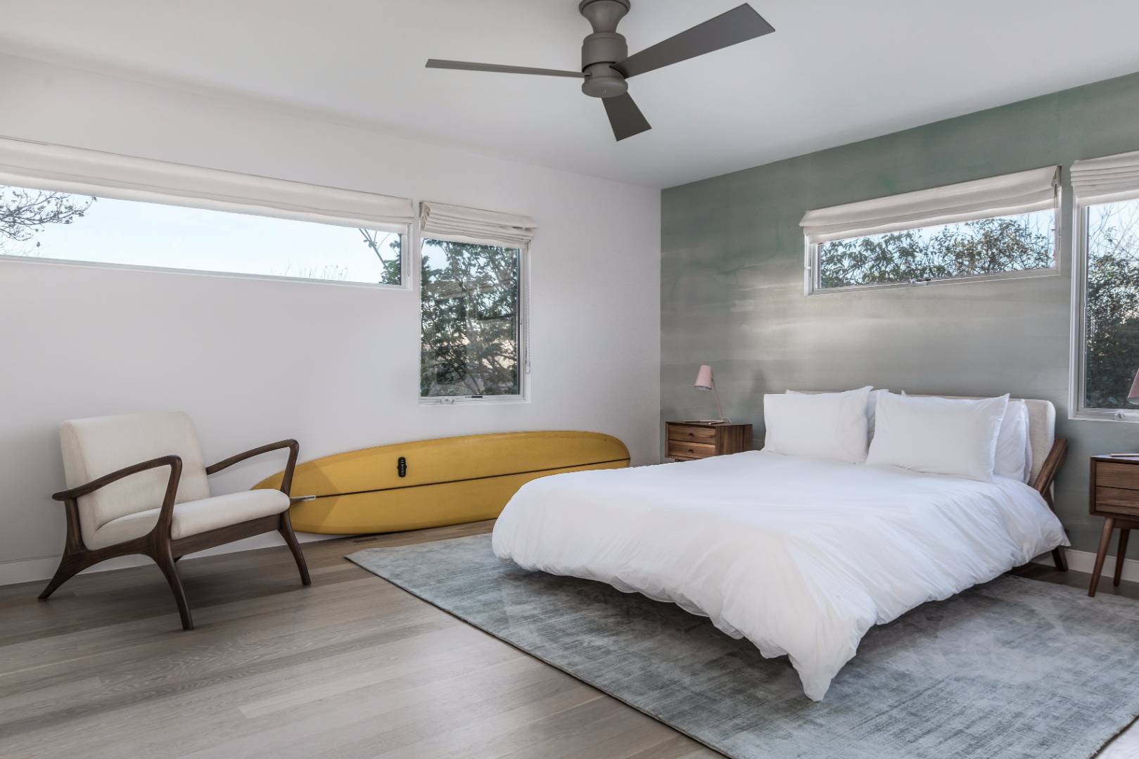 83 North Surfside Avenue Montauk, NY 11954 - Photo 14 of 26 a bedroom with a bed a chair and a couch