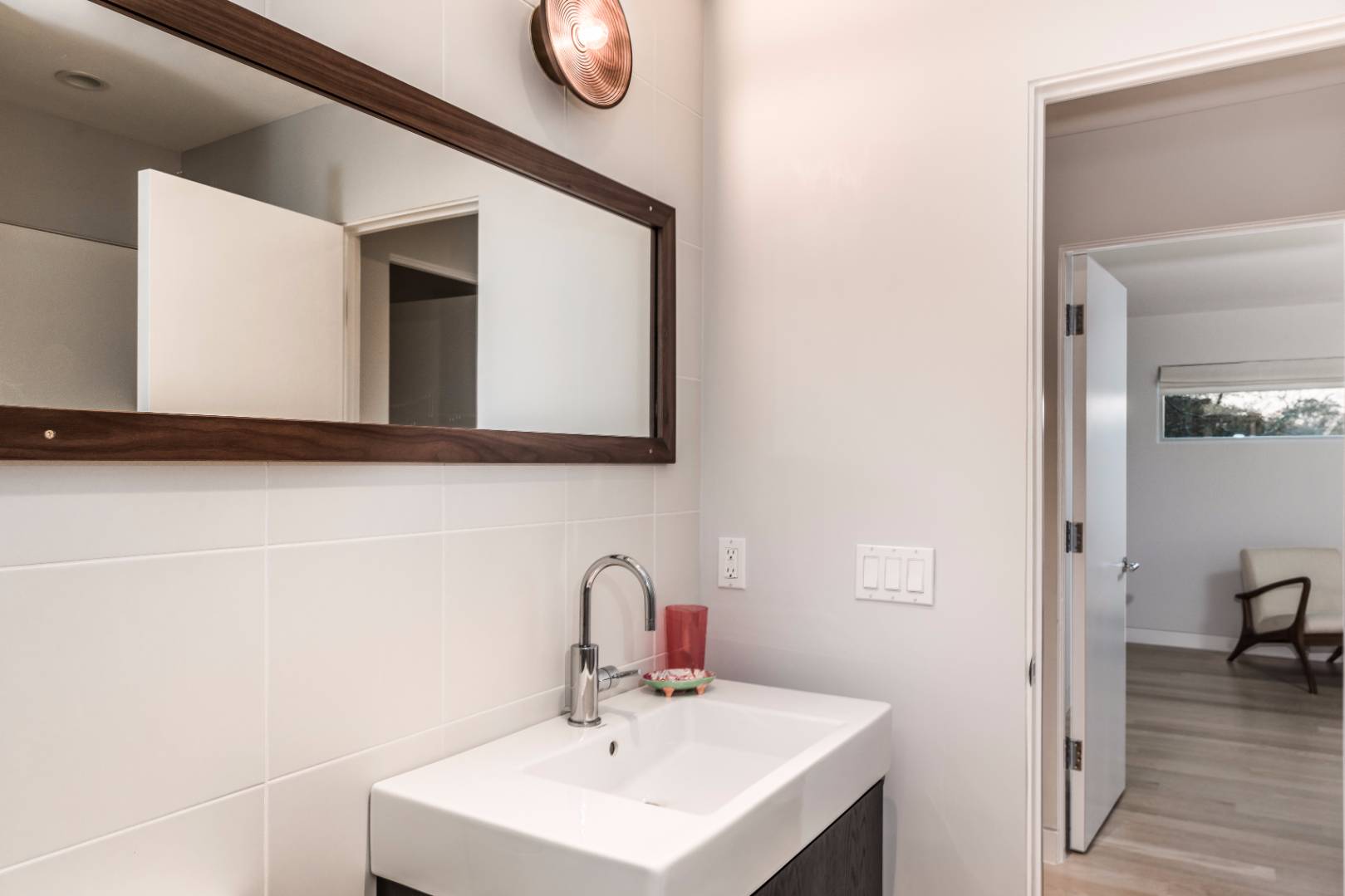 83 North Surfside Avenue Montauk, NY 11954 - Photo 15 of 26 a bathroom with a sink and a mirror