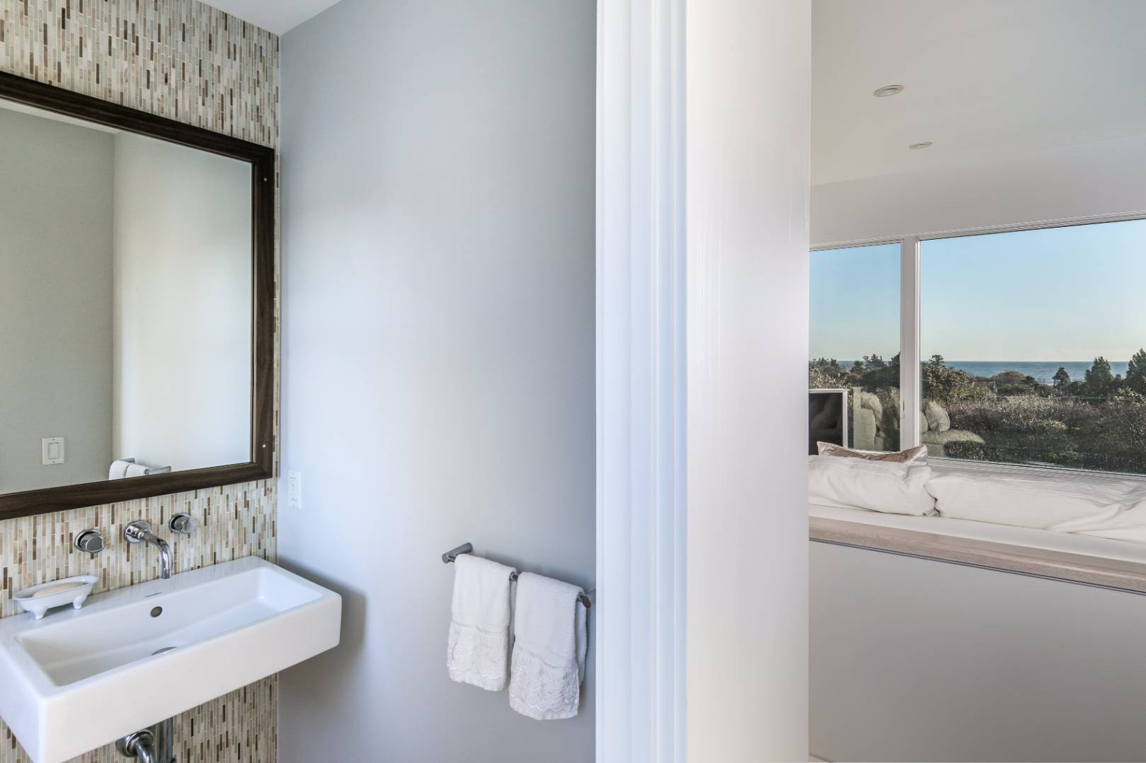 83 North Surfside Avenue Montauk, NY 11954 - Photo 16 of 26 a bathroom with a sink and a mirror