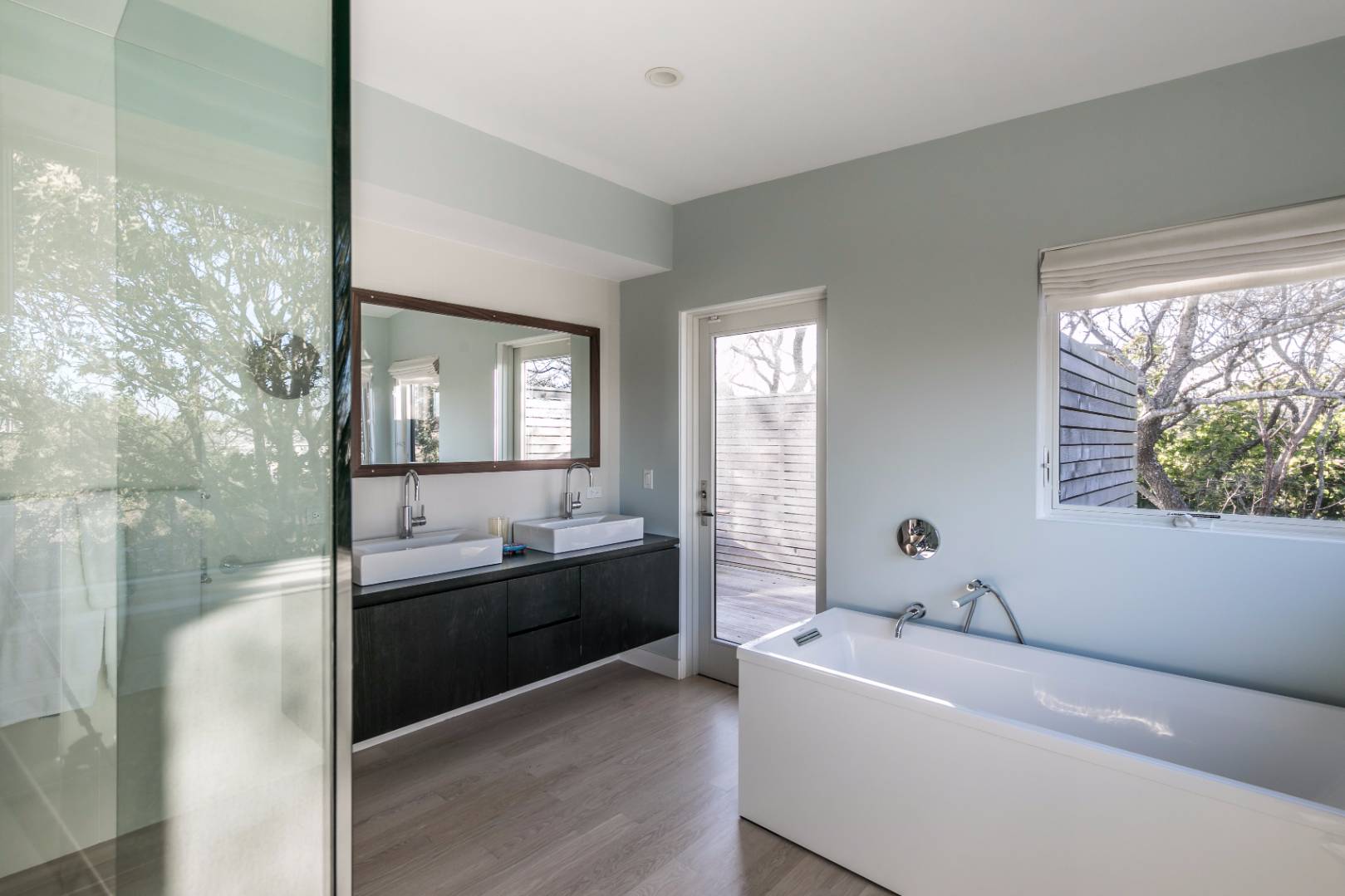 83 North Surfside Avenue Montauk, NY 11954 - Photo 19 of 26 a bathroom with a tub sink and mirror