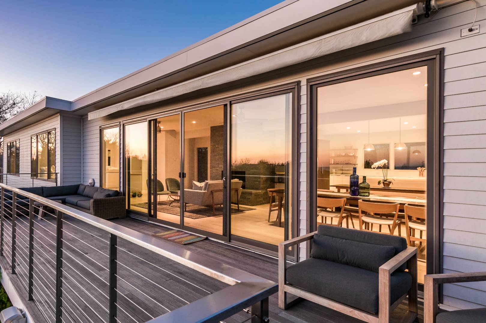 83 North Surfside Avenue Montauk, NY 11954 - Photo 3 of 26 a living room with large windows
