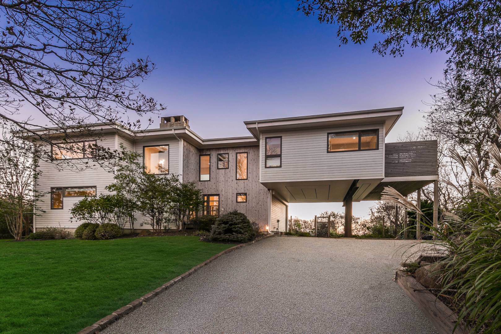 83 North Surfside Avenue Montauk, NY 11954 - Photo 4 of 26 a view of a house with a garden and pathway