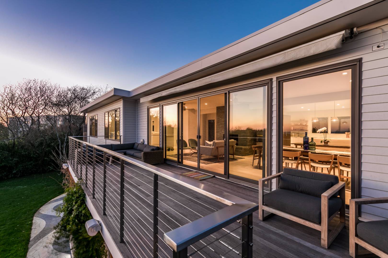 83 North Surfside Avenue Montauk, NY 11954 - Photo 5 of 26 a balcony with hardwood filled with table and chairs