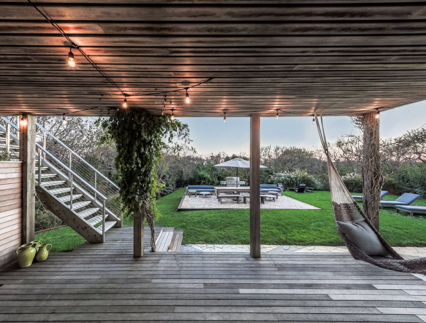 83 North Surfside Avenue Montauk, NY 11954 - Photo 6 of 26 a view of a porch and garden