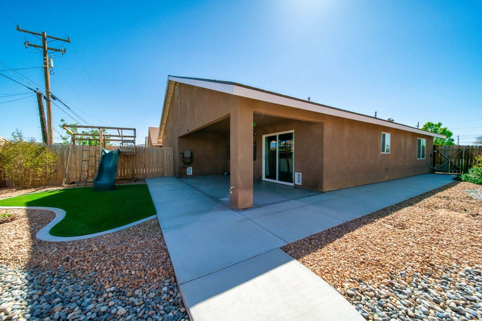 1540 Mayo Street Ridgecrest, CA 93555 - Photo 31 of 32 a front view of a house with garden