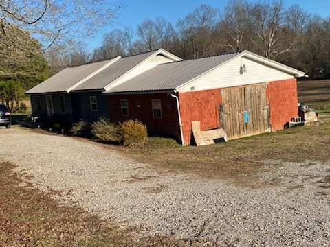 2705 Johnson Branch Road Leoma, TN 38468 - Photo 2 of 16 a view of a house with a yard and garage