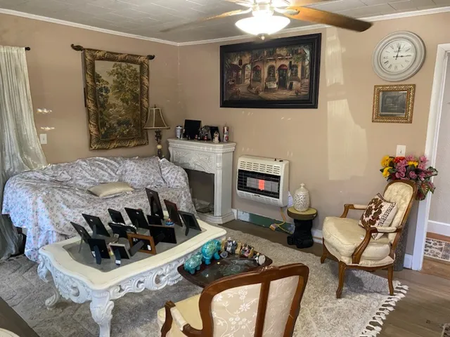 a living room with furniture and a fireplace